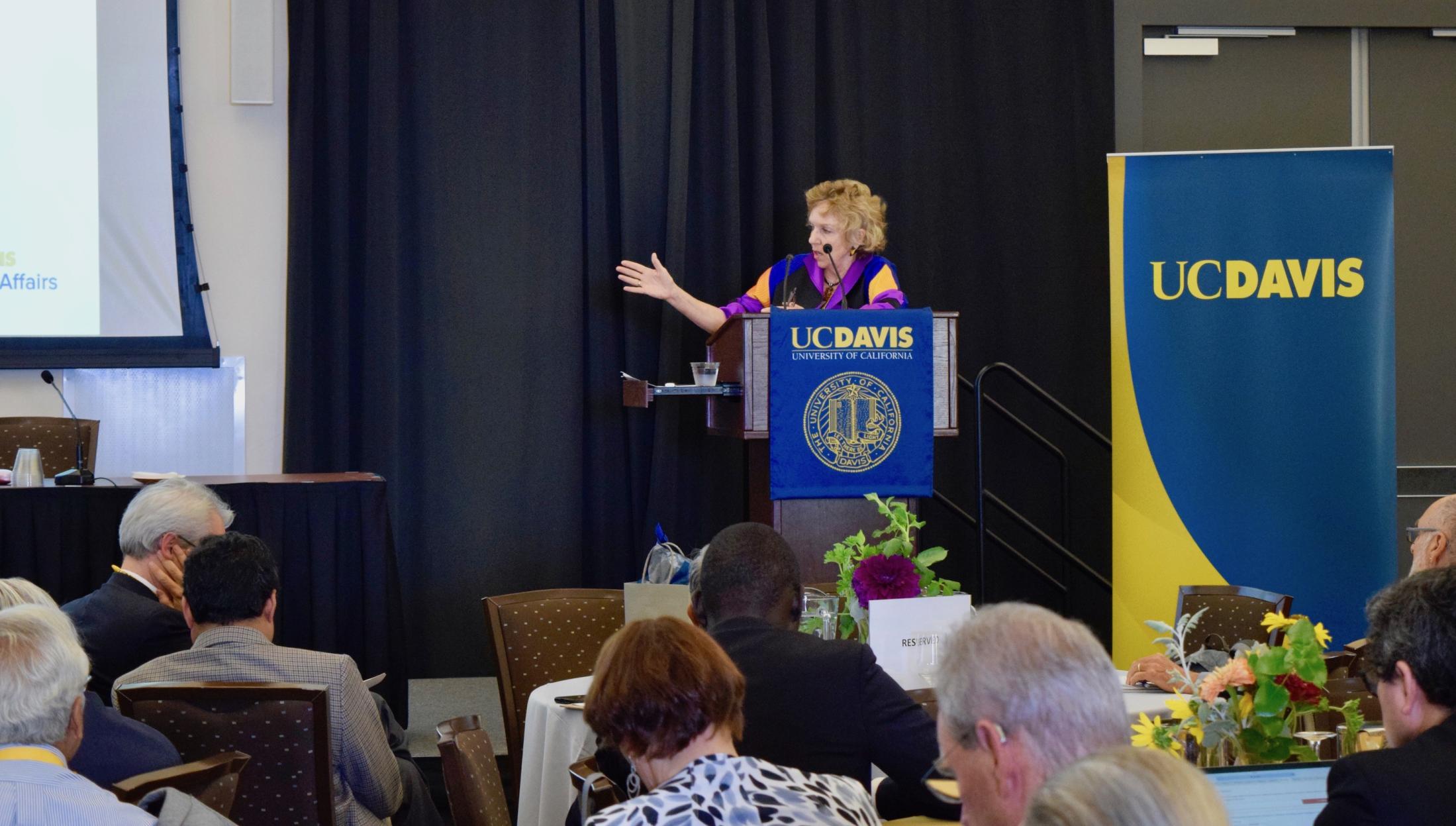 Professor Patricia Conrad speaking at podium