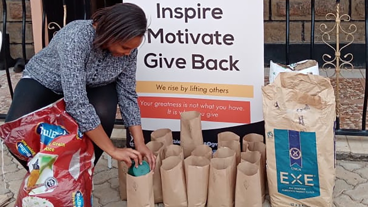 Winfred Mutinda packing donations