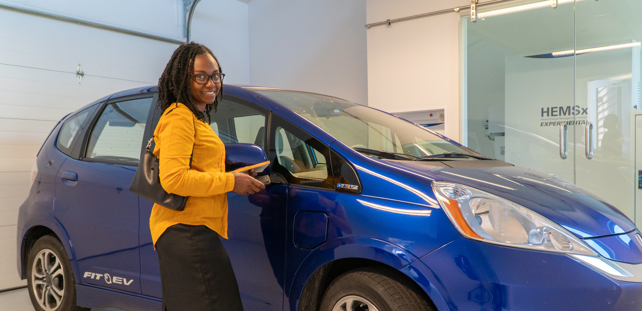 woman standing with car