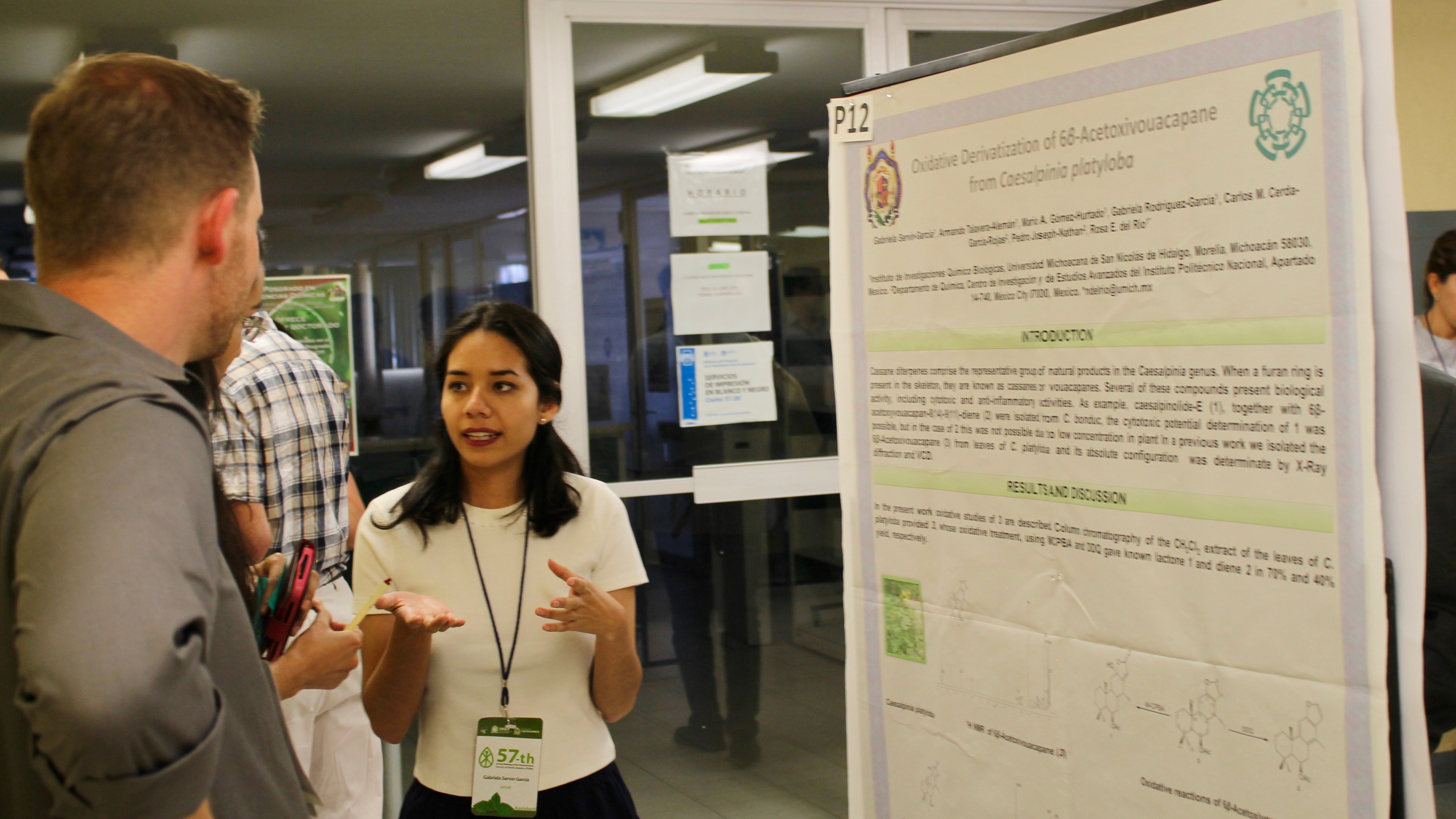 Zerbe at a poster session with international students from Mexico