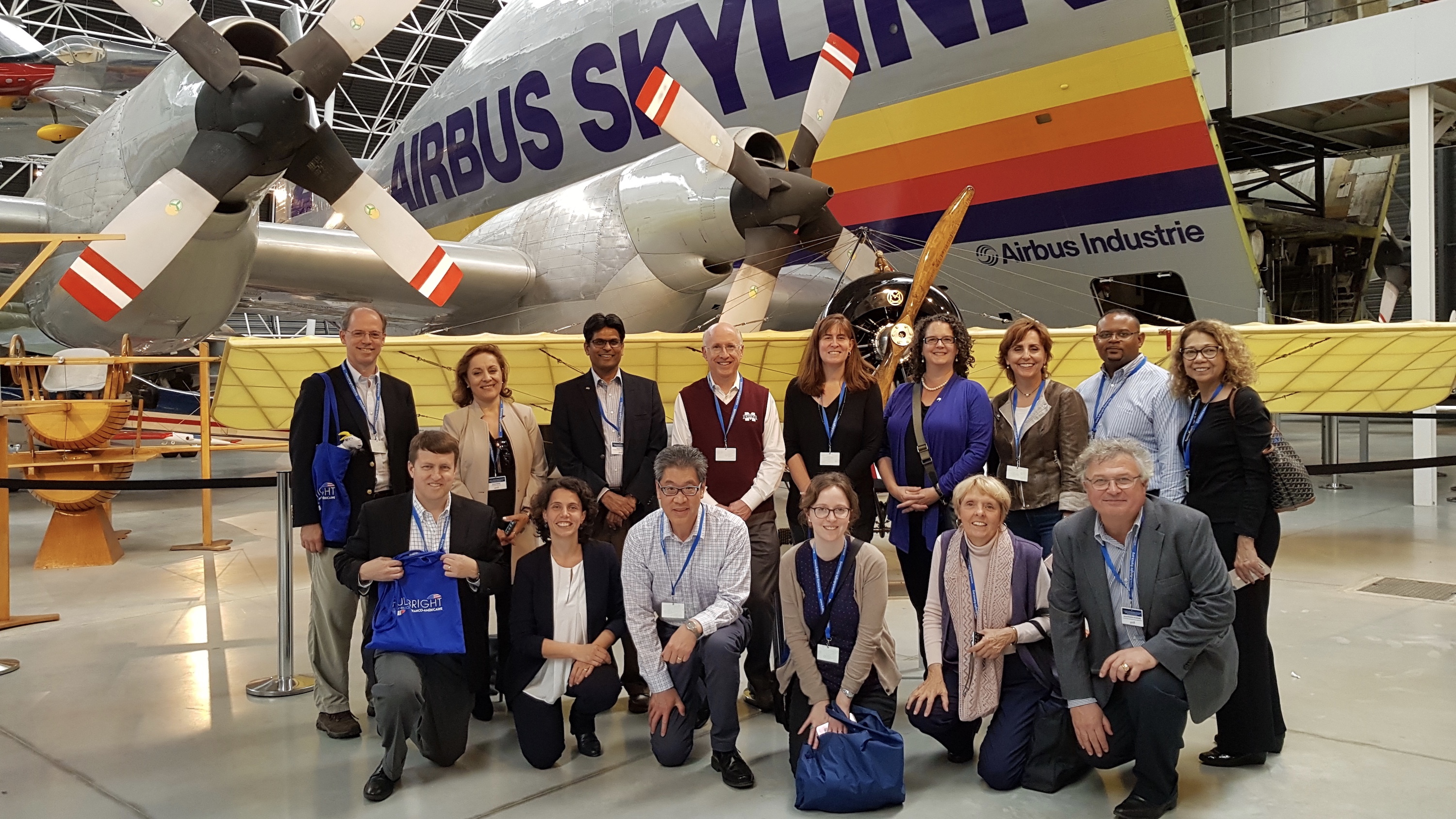 The Fulbright International Education Administrators (IEA) Seminar to France group (Director of Services for International Students and Scholars (SISS) Wesley Young third from left, kneeling) at the Airbus factory in Toulouse.