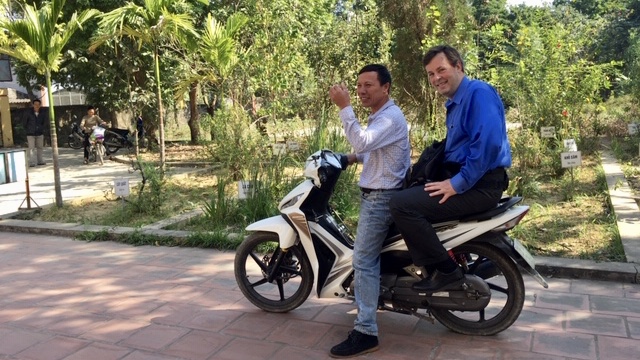 Hinton enroute to conduct an intervention In the field in Sóc Sõn, a semi-rural district in Hanoi. Many of the homes are accessible only by motorcycle or on foot.