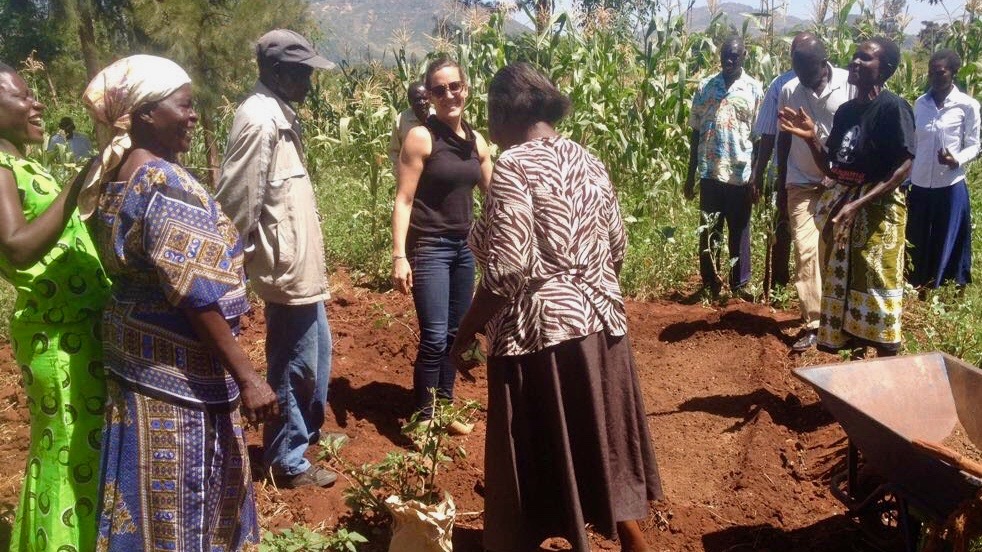 Waterman in Kisumu, Kenya with farmers who are learning to grow, process and eat moringa leaves.