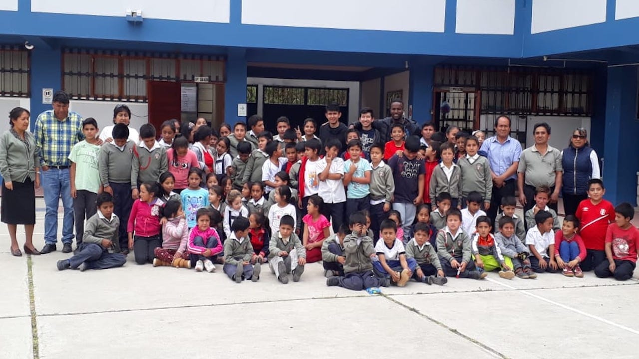 Group pictures of children and staff from La Huaylla's elementary school