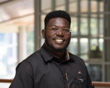 Headshot of Roy Akumu.