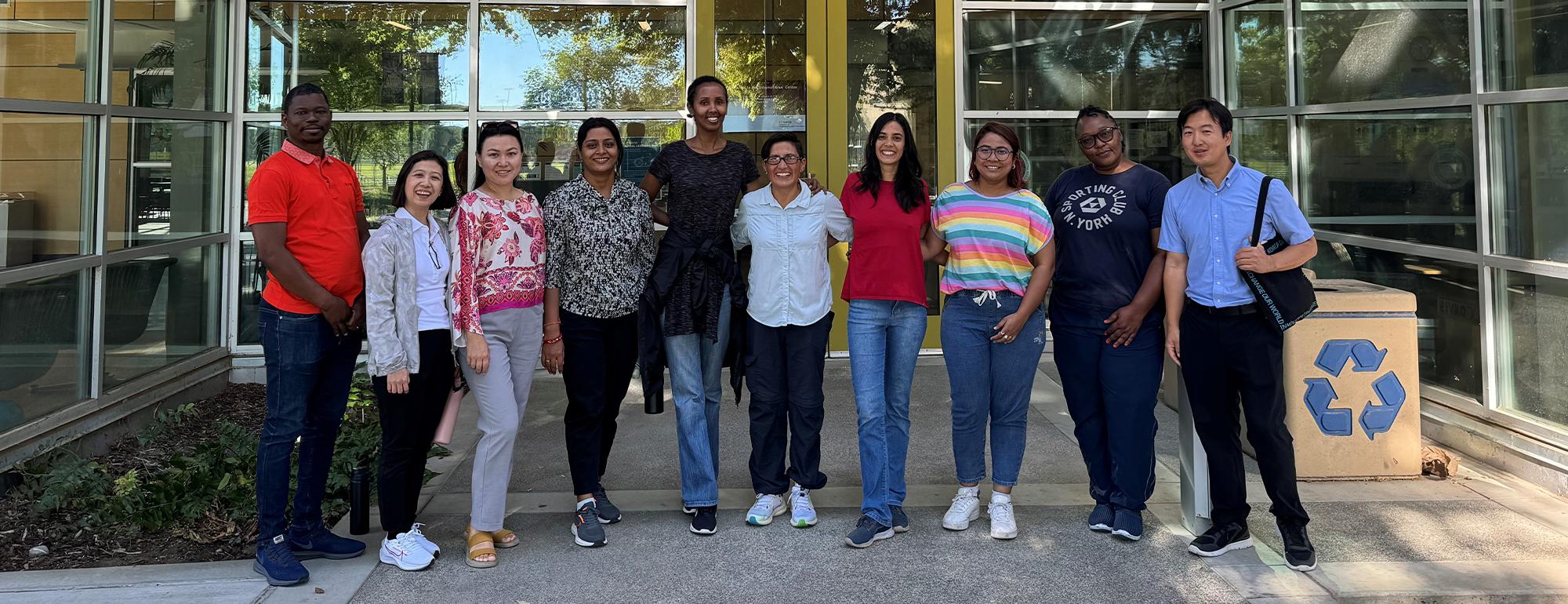 Ten Humphrey Fellows stand in front of the International Center.