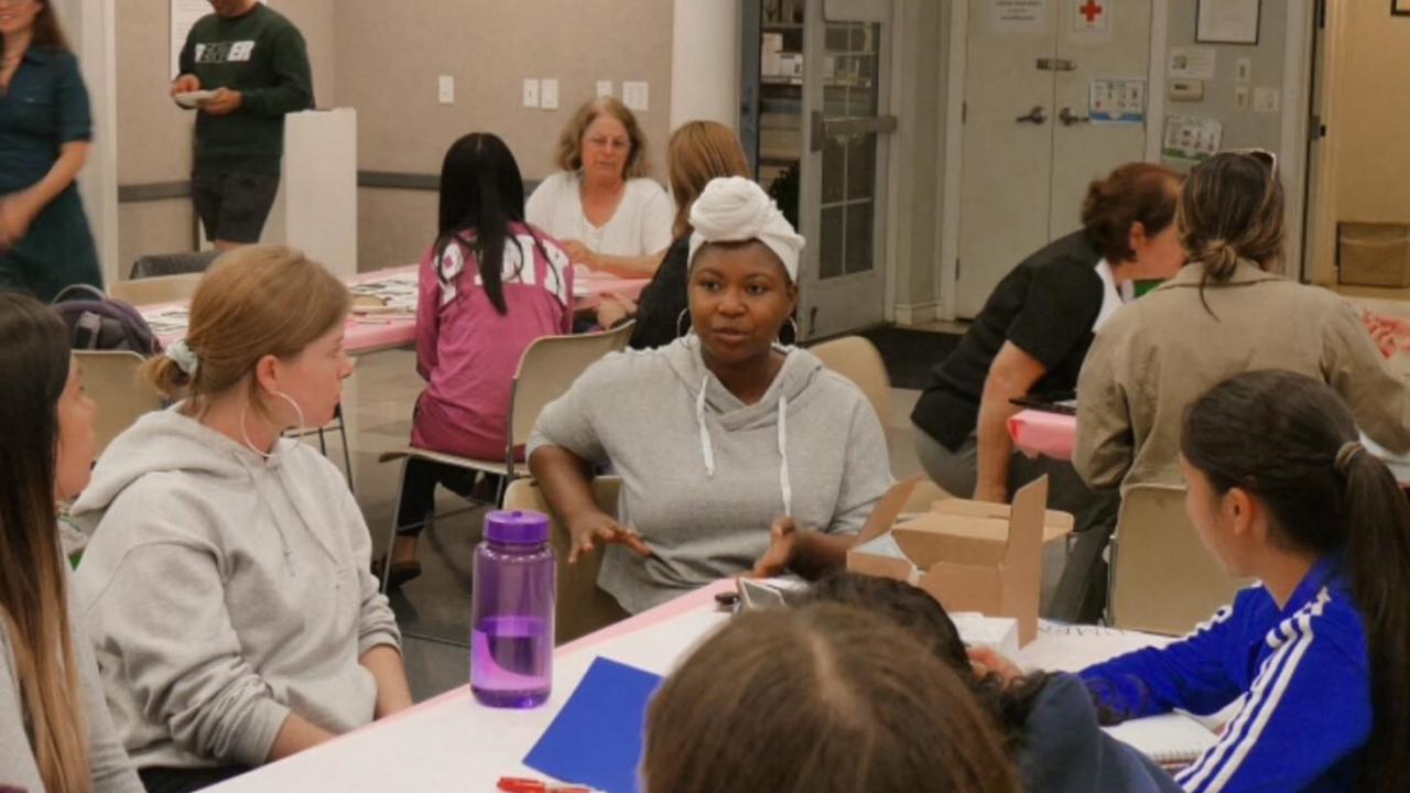 Valencia Scott, center, of the AB540 & Undocumented Student Center at UC Davis, talks about the center’s work during an immigration forum at International House Davis last week. Myra Casillas/Courtesy photo exhibit