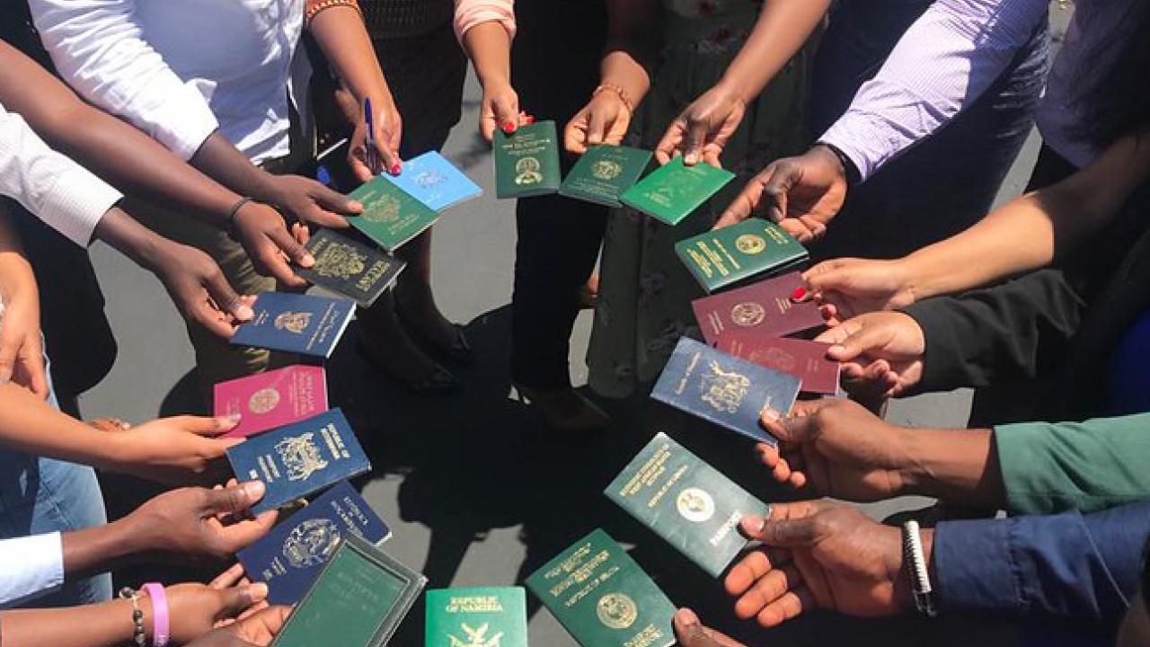 UC Davis Mandela Washington Fellows from various Sub-Saharan nations hold their passports. The 2020 Mandela Washington Fellowship has been postponed until 2021. Mandela Fellows holding passports in a circle