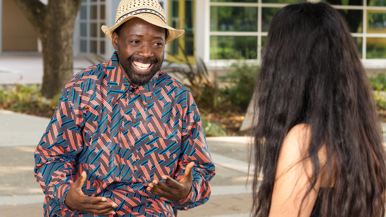 2018-19 UC Davis Humphrey Fellow Venance Segere from Tanzania  enjoying a discussion outside the UC Davis International Center.