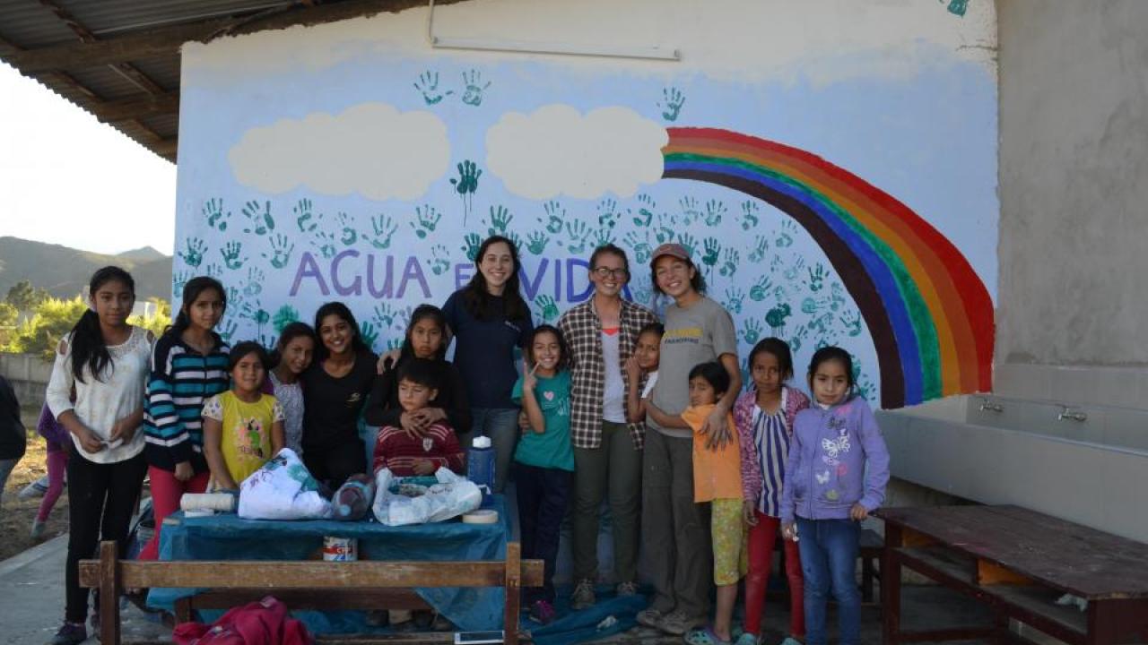 The La Huaylla, Peru Implementation trip, summer of 2017. Travelers painted a mural with the kids at the local school house, which read "Agua es Vida," meaning "Water is Life." (The Peru2018 Travel Team/UC Davis) Peru Implementation trip