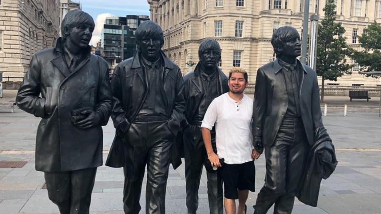The 5th Beatle: Gonzales stands among four statues commemorating the members of The Beatles on a London street. (Courtesy Adrian Gonzales) The 5th Beatle: Gonzales stands among four statues commemorating the members of The Beatles on a London street. (Courtesy Adrian Gonzales)