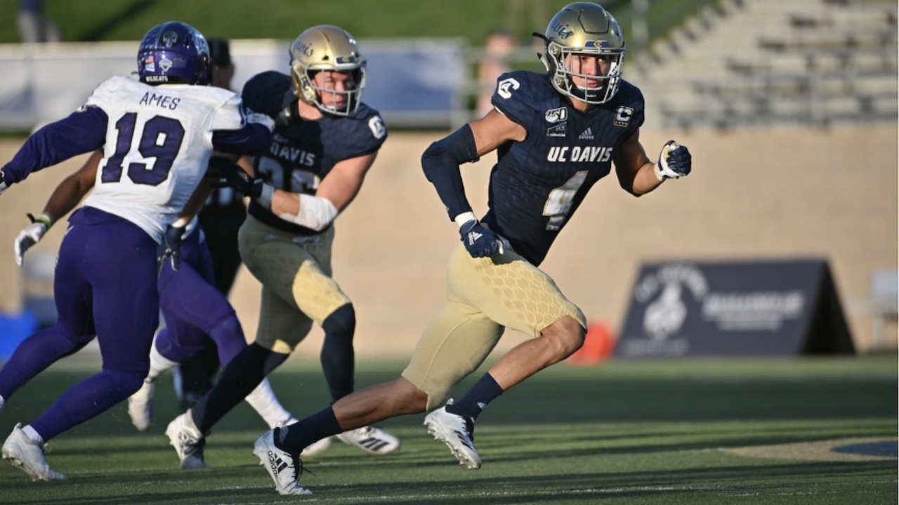 Former Aggie Tiger Garcia is a candidate for the vaunted Rhodes Scholarship. WAYNE TILCOCK – AGGIEPHOTO.COM Tiger Garcia running on football field.