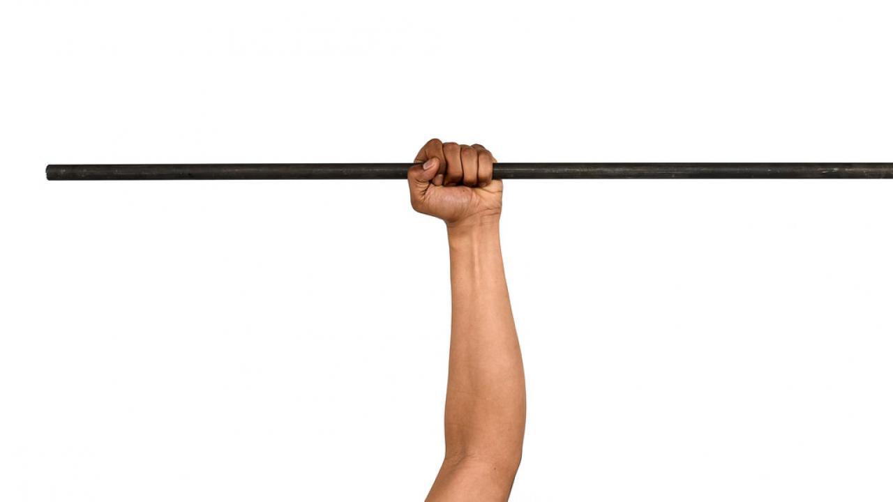 Signature image for "Useful Fictions" by Tim Hyde. Arm with a bar