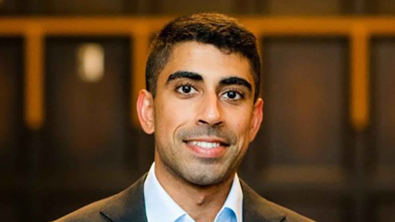 Photo of UC Davis student Gurshan Rai dressed in a collared shirt and suit jacket