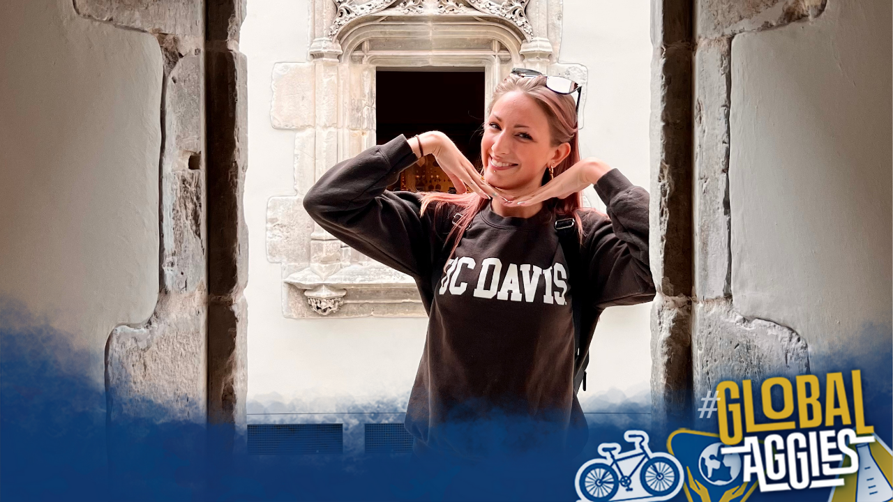 Jessica in Scotland with the Global Aggies logo in the right hand corner.