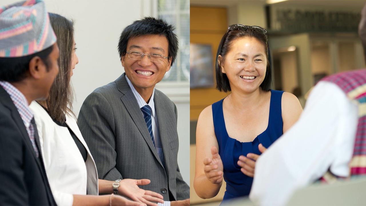 On the left, Zhong Zhao talks to two other Humphrey fellows. He offers them a joyful smile. He has short straight black hair, wireframed rectangular glasses, and wears a light gray pinstripe suit jacket, striped shirt and navy blue and light blue tie. On the right, Selenge Chadraabal speaks to a Humphrey fellow. She has chin-length straight black hair and wears a dark blue sleeveless top. Her glasses are pushed up on top of her head, she smiles at her colleague.