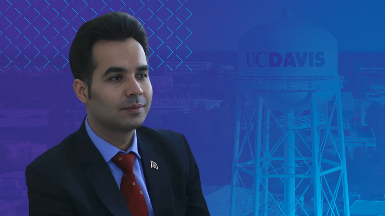 Dr. Alemi headshot over a backdrop of the UC Davis water tower