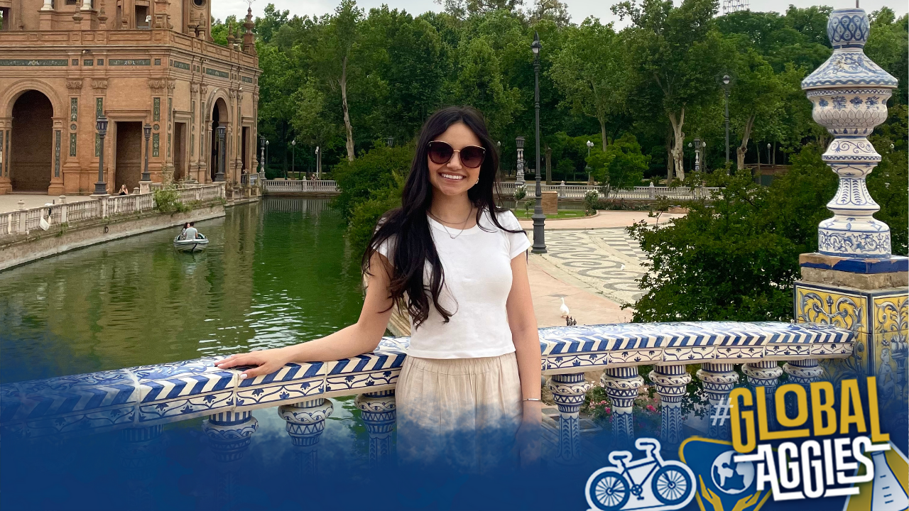 Kate at the Plaza de España in Sevilla, Spain, with global aggies bottom border.
