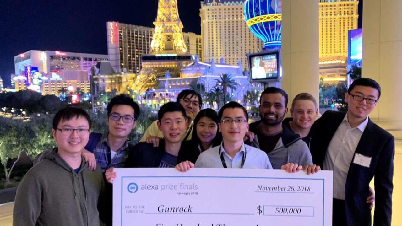 Students with award check
