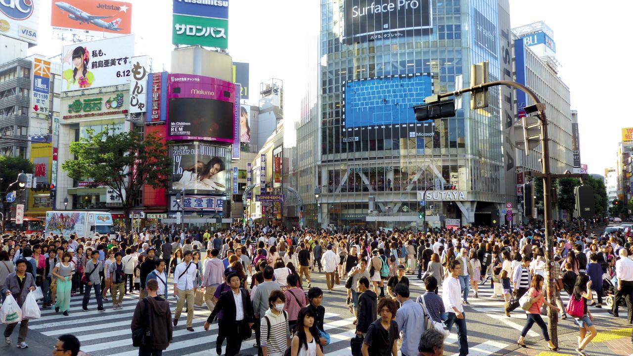 Pedestrians crowding the streets of Japan.