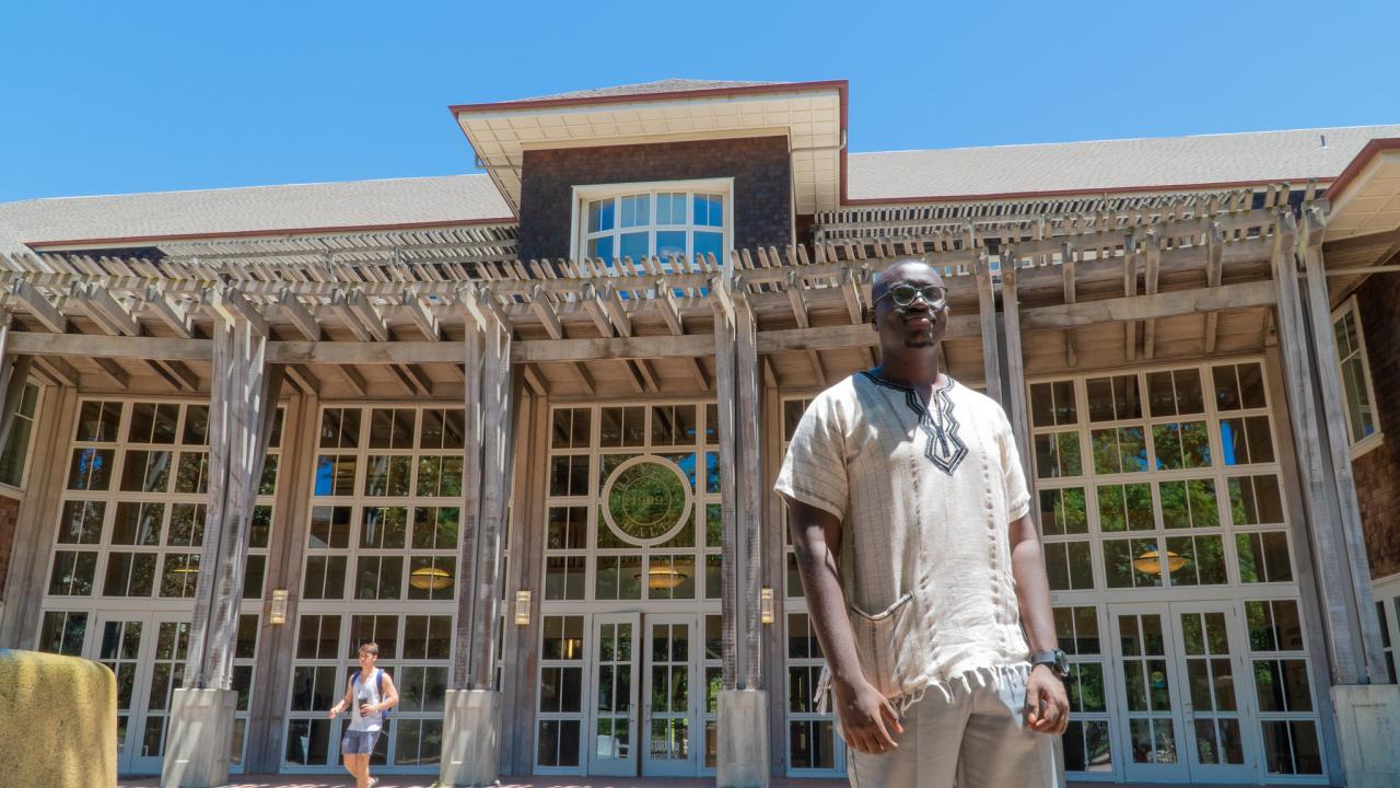 2019 Mandela Washington Fellow standing at Dutton Hall on campus