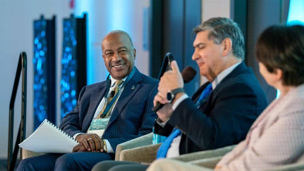 UC Davis Chancellor Gary S. May smiles while speaking at a panel