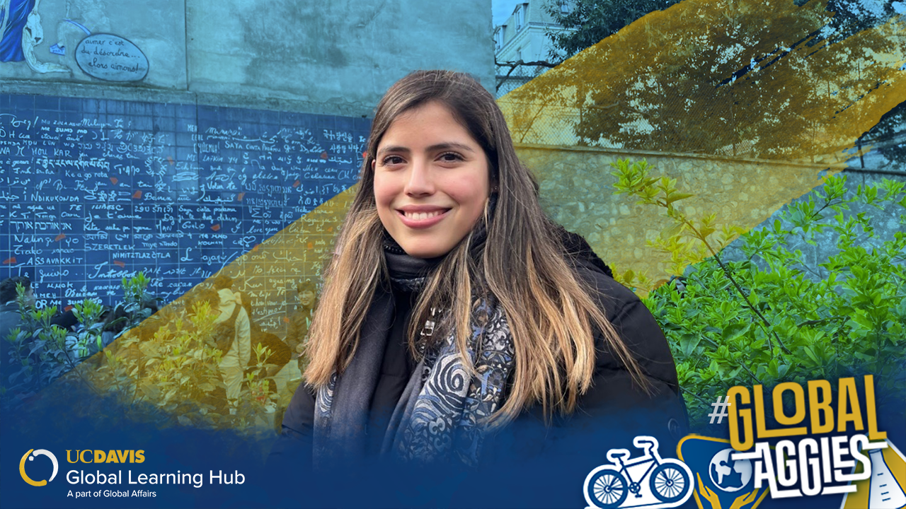 Valeria smiles in France with a gradient overlay of blue, yellow, and green in the background.