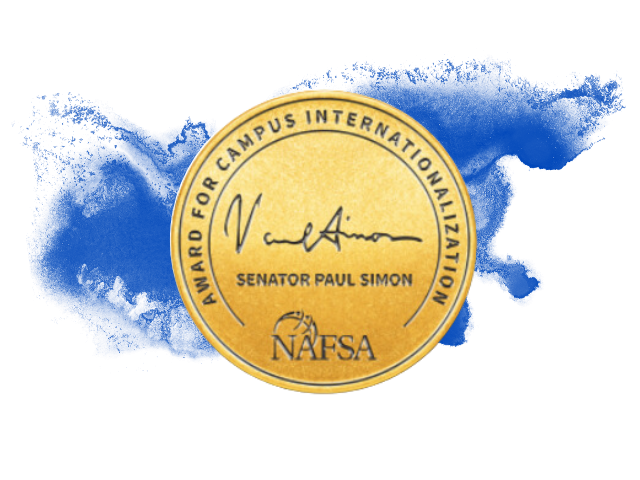 Senator Paul SImon Award with a blue watercolor behind it