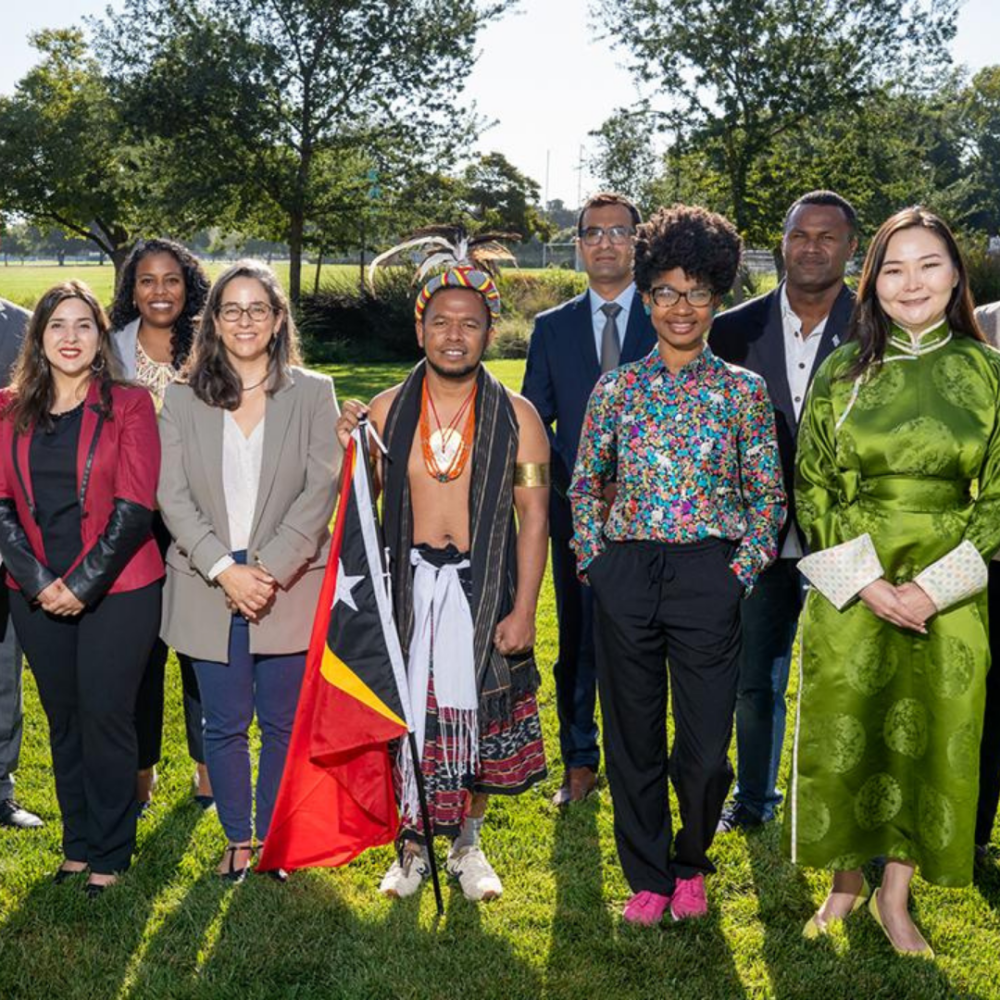 A group of Humphrey Fellows at UC Davis posing formallly in attire from their home country