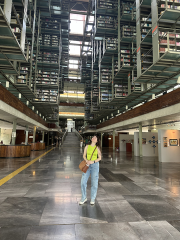 Elmira looks up at the seemingly infinite rows of books in Biblioteca Vasconcelos, one of the main libraries in Mexico City.