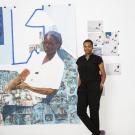 Njideka Akunyili Crosby pictured standing next to her art work 
