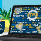 Laptop on desk with languages and world icons