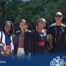 Seven students smiling in a campus photo with UC Davis and Global Aggies logos