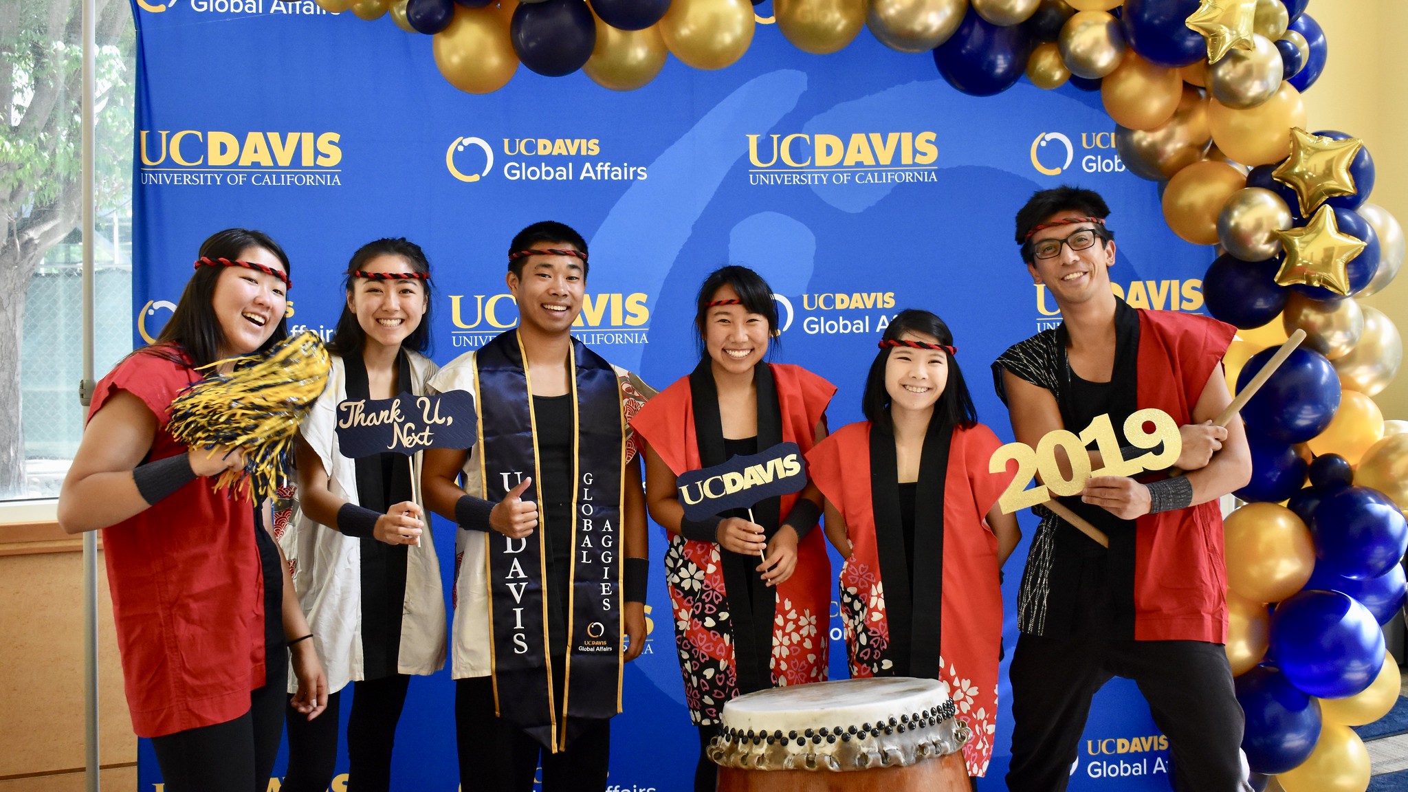 group of taiko drummers and balloons