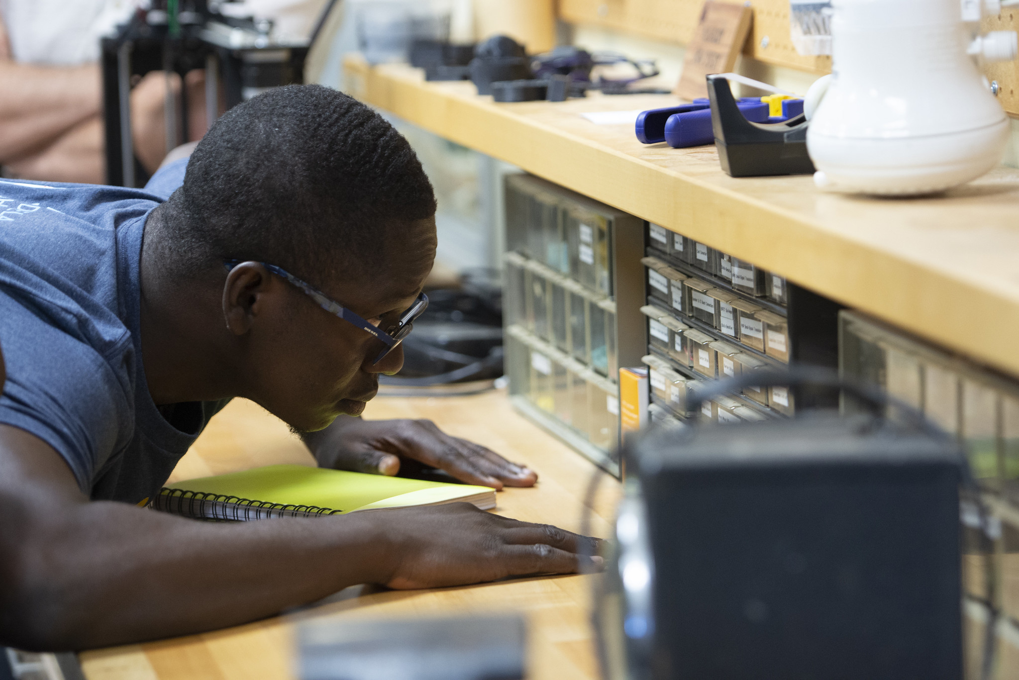 Mandela Fellow looking at tools