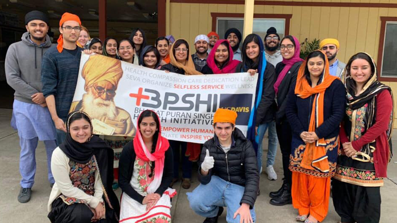 group of students standing with a sign that says BPSHI