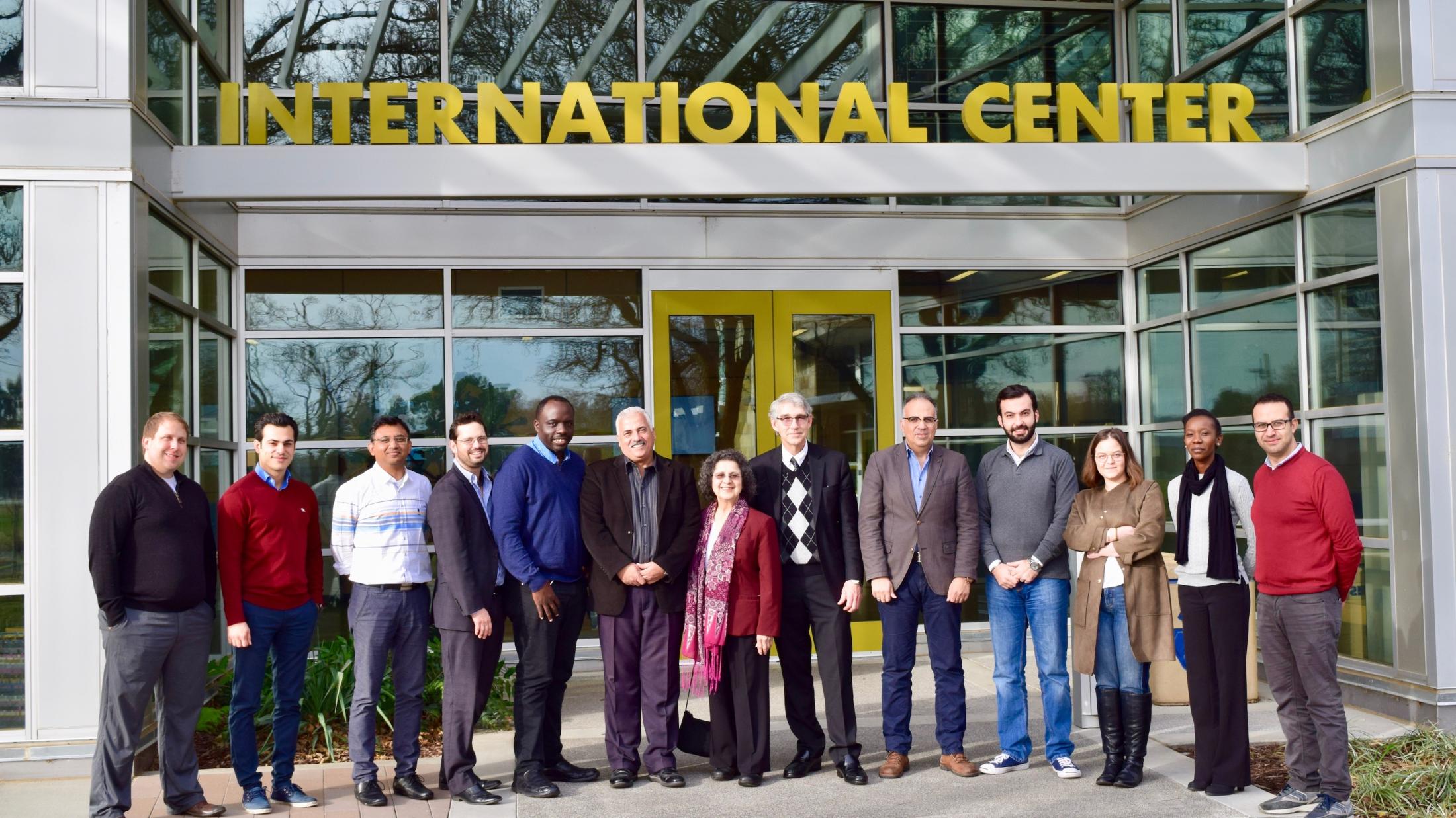 faculty outside International center on campus