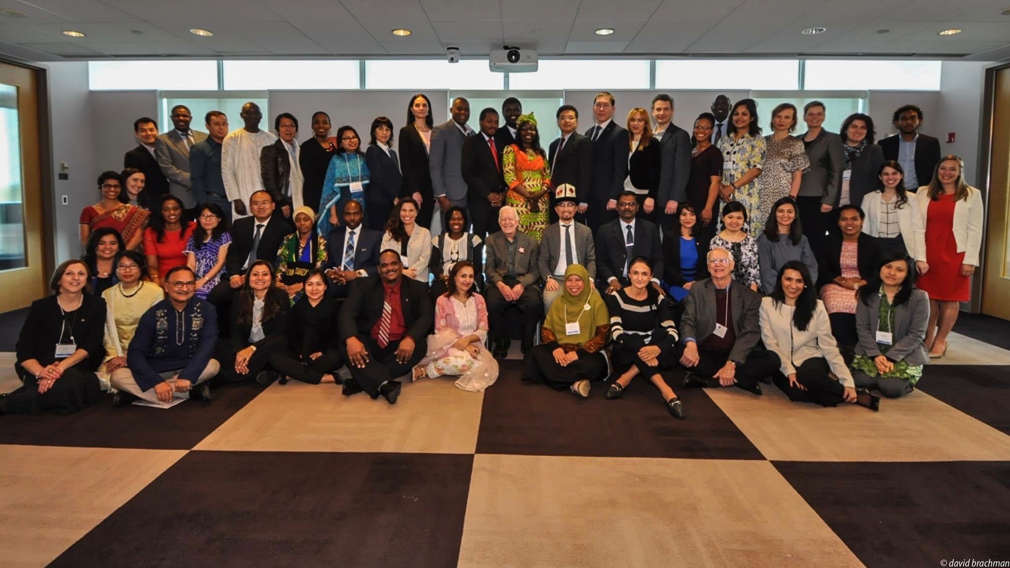 Hubert H. Humphrey Fellows posing with President Jimmy Carter (Center) at the Global Development and Social Justice Enhancement Workshop.