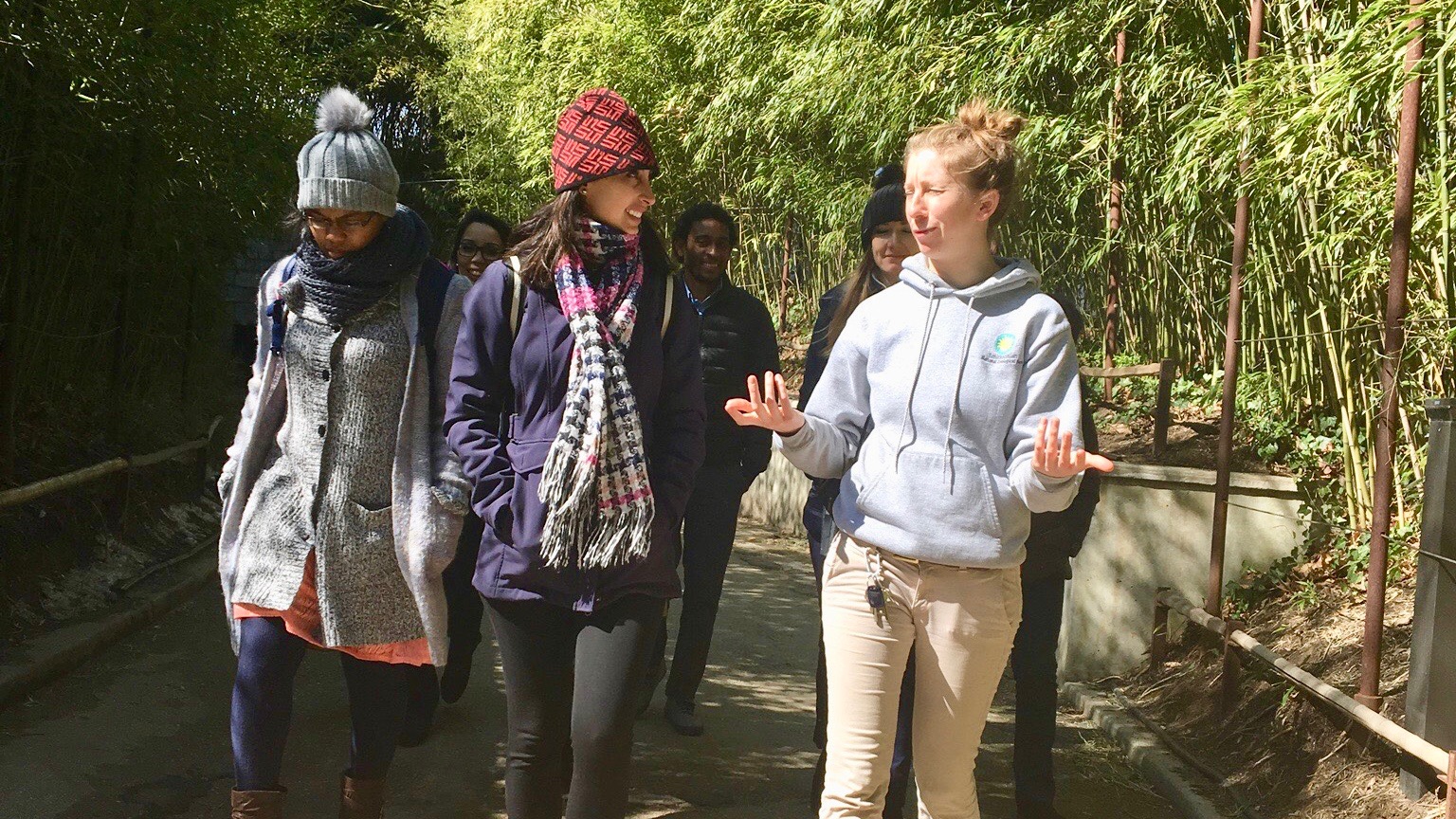 UC Davis Humphrey Fellows Litia Gaunavou-Tuberi (Fiji) and Maria Fernanda Gonzalez (Ecuador) on a guided tour by UC Davis Alumna and Smithsonian National Zoological Park Animal Keeper Shellie Pick.