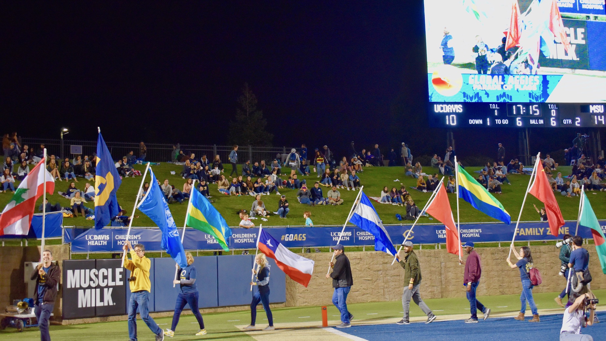 Global Aggies waving flags