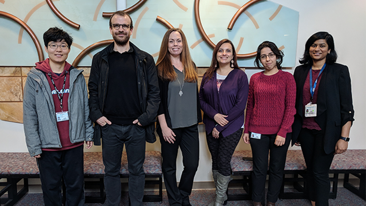 Jennifer Aten (center) with a few of the international scholars she has helped bring to the UC Davis Department of Neurology. Jennifer Aten and international scholars