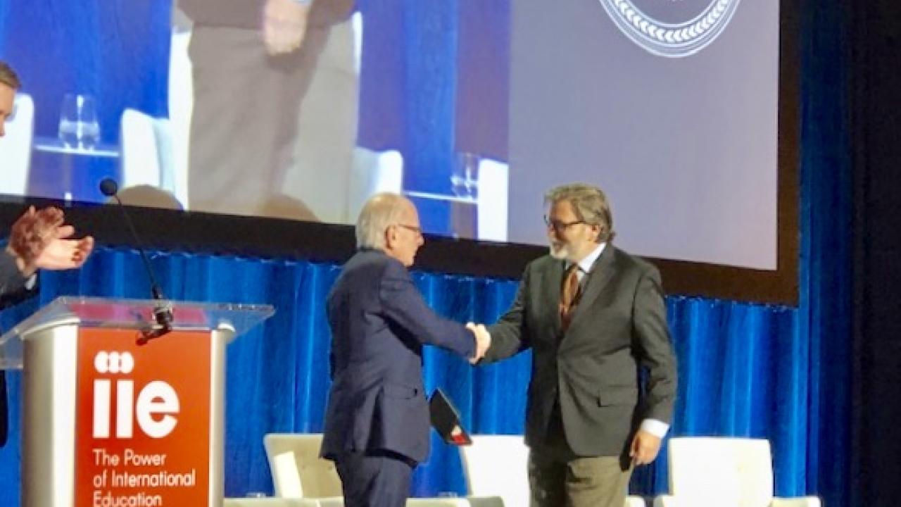Professor Keith David Watenpaugh receiving the Institute of International Education (IIE)'s Centennial Medal from IIE President Alan E. Goodman. Professor Keith David Watenpaugh receiving the Institute of International Education's Centennial Medal.