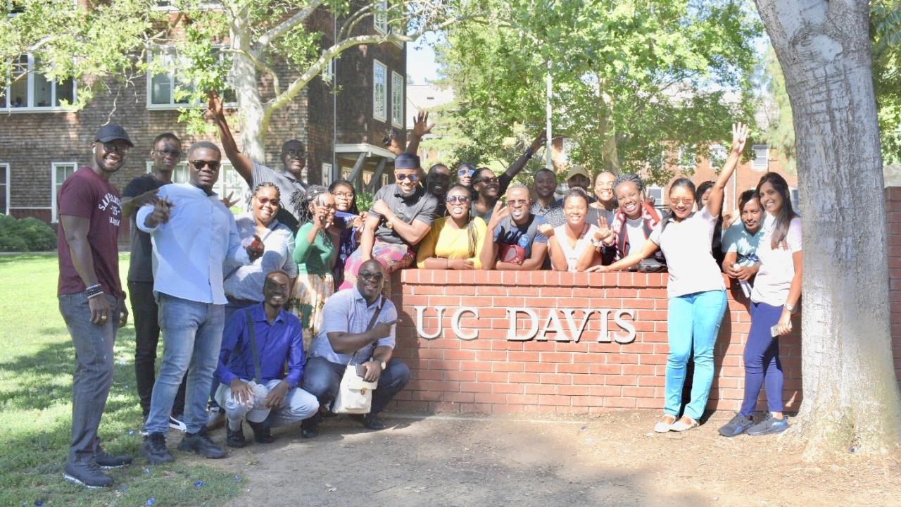 The 2019 UC Davis Mandela Washington Fellows during their first tour of campus. Andrea Esquetini/UC Davis UC Davis Mandela Fellows with UC Davis sign on campus