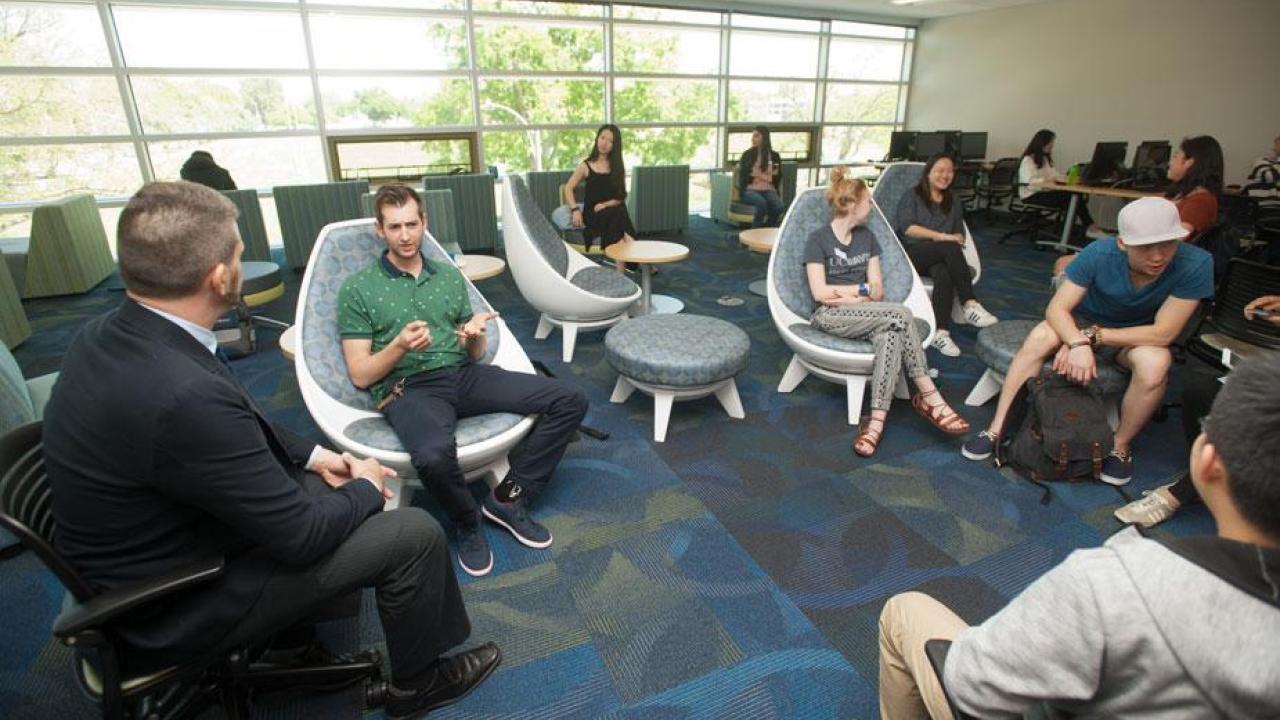 The April 21 open house included the UC Davis International Human Library, in which visitors sat down with international students, scholars and others — the books — to hear their stories. (Gregory Urquiaga/UC Davis photos) Human Library