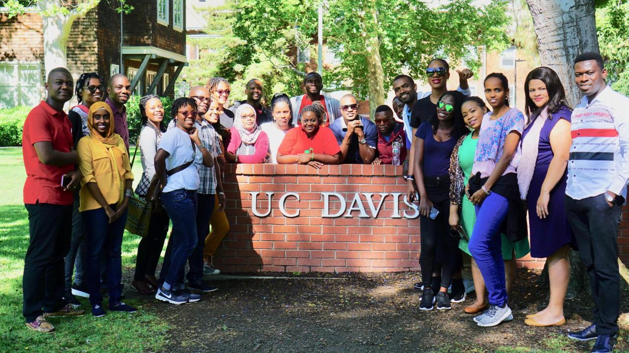 The 2018 UC Davis Mandela Washington Fellows pose for a photo during their first day on campus. Tene Goodwin/UC Davis. Mandela Fellows at UC Davis sign on campus