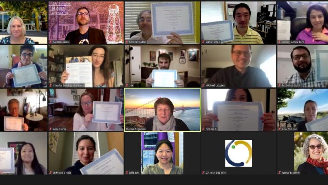 Faculty members who participated in the Curriculum Enhancement Through Global Learning program hold up their certificates of completion. Faculty members who participated in the Curriculum Enhancement Through Global Learning program hold up their certificates of completion.