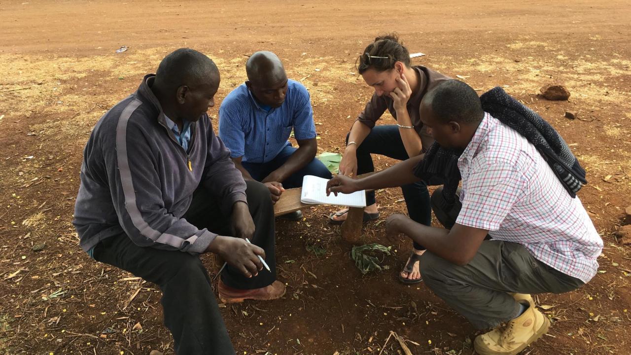 Waterman (second from right) drafting construction plans for a moringa shade drying structures using local materials in Meru, Kenya. Waterman drafting construction plans for a moringa shade drying structures using local materials in Meru, Kenya.